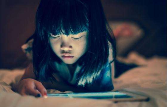 young girl using tablet device young girl using tablet device