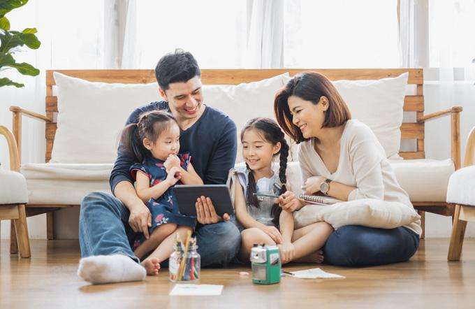 Family looking at a tablet Family looking at a tablet