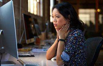 Woman looking at a computer