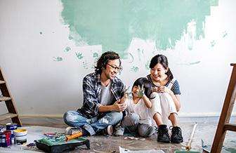 Family painting a wall