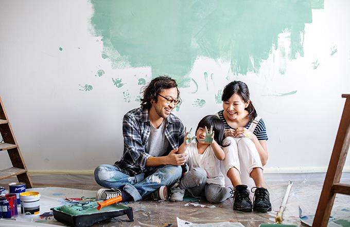 Finance your home renovations Family painting a wall